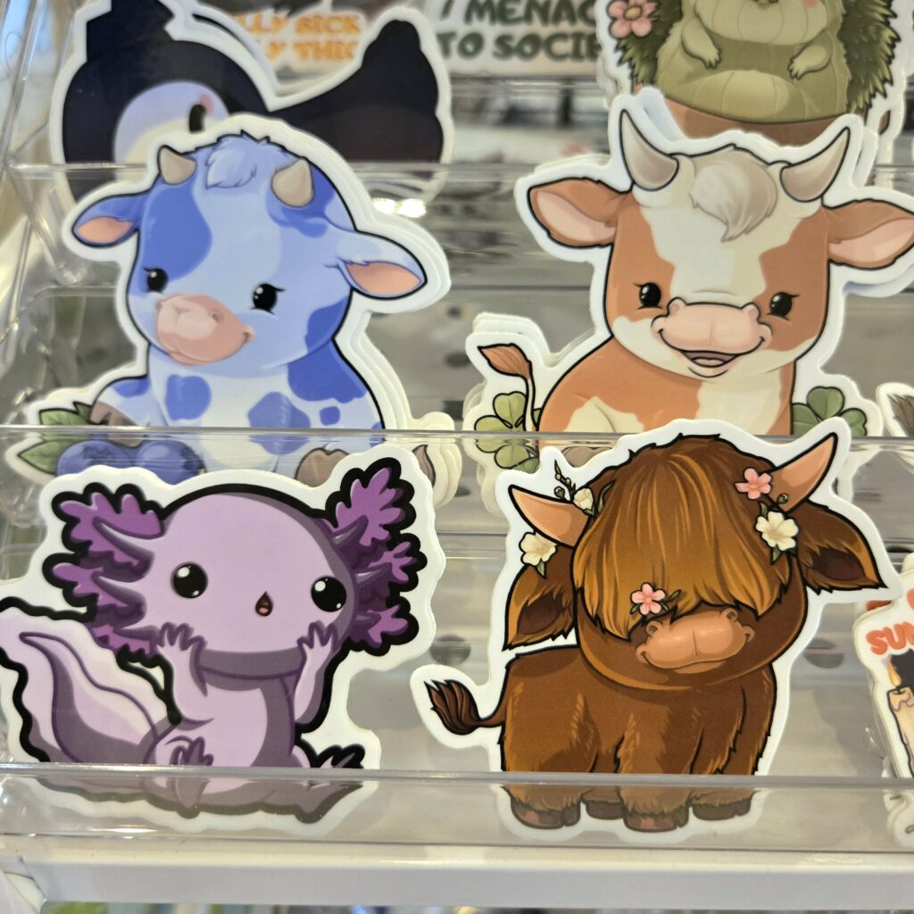 Kawaii animation style cute stickers of cows and axolotl
