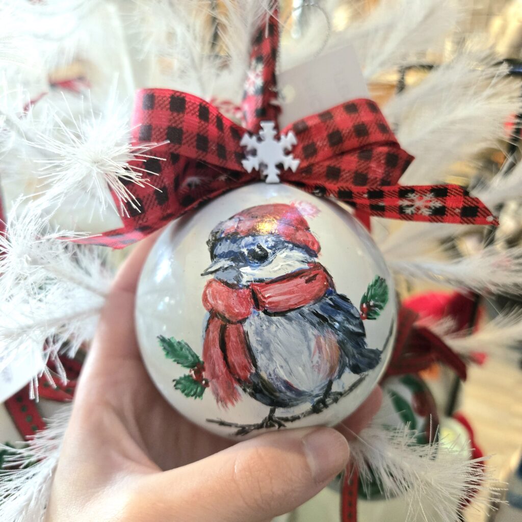 hand painted christmas holiday ornament of a bird wearing a hat and scarf