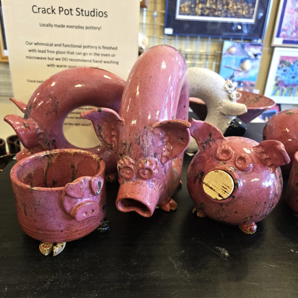 Ceramic pink piggy banks and bowls.
