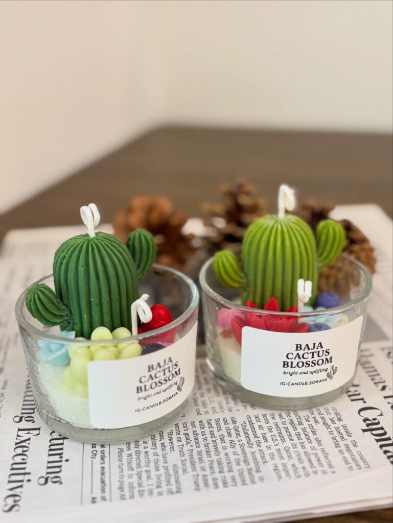 candle with cactus and flowers. Sculpted wax